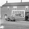 The first Cooper Office Equipment billboard sign. The building pictured is now home to "Ernie's Pub" in downtown Escanaba.